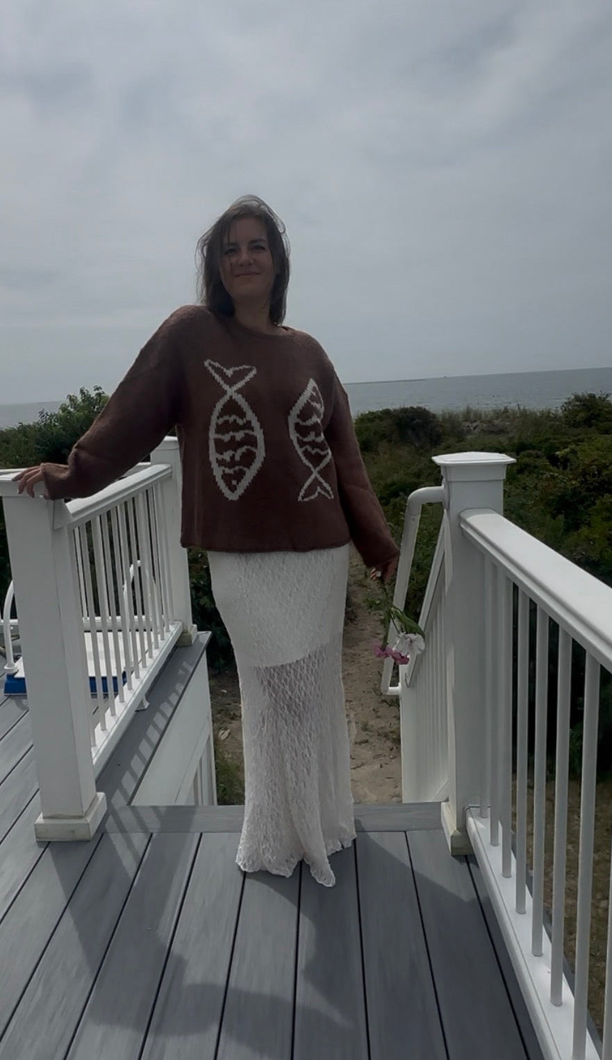 Brown knit sweater with two fish motifs on front